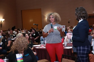 Woman presenting at a NWIR gathering